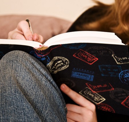 Girl writing in a journal