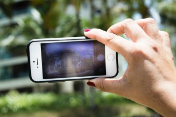 photography-of-person-holding-an-iphone-5s-1744790